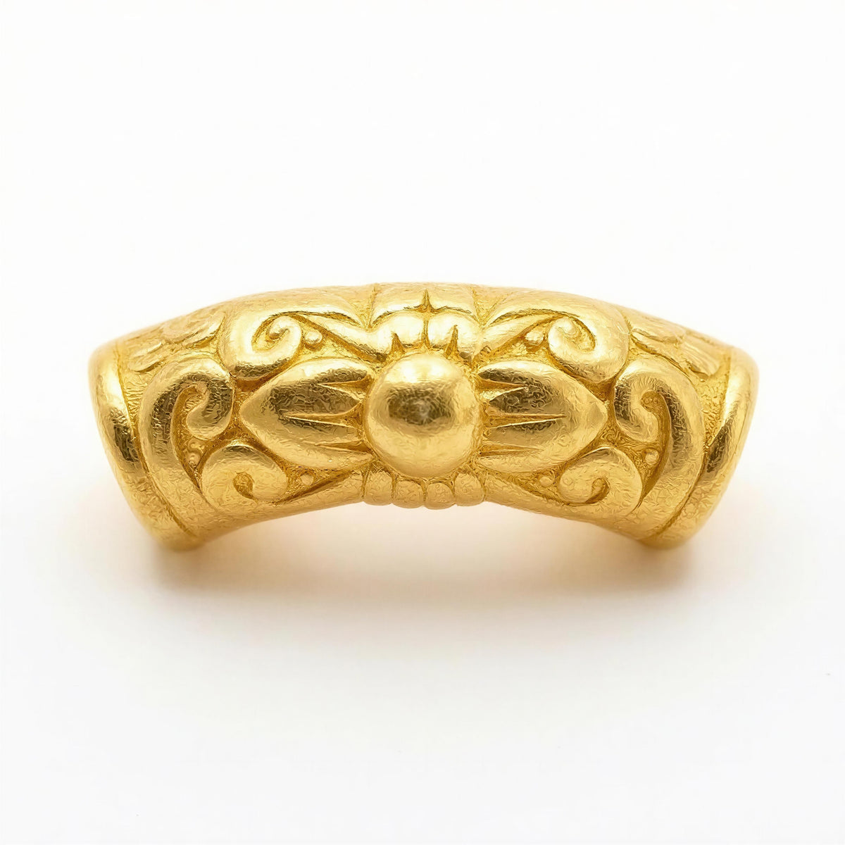 Intricately designed gold bead with floral and scroll motifs, representing luxury handcrafted details for Necklaces - AURELIS.
